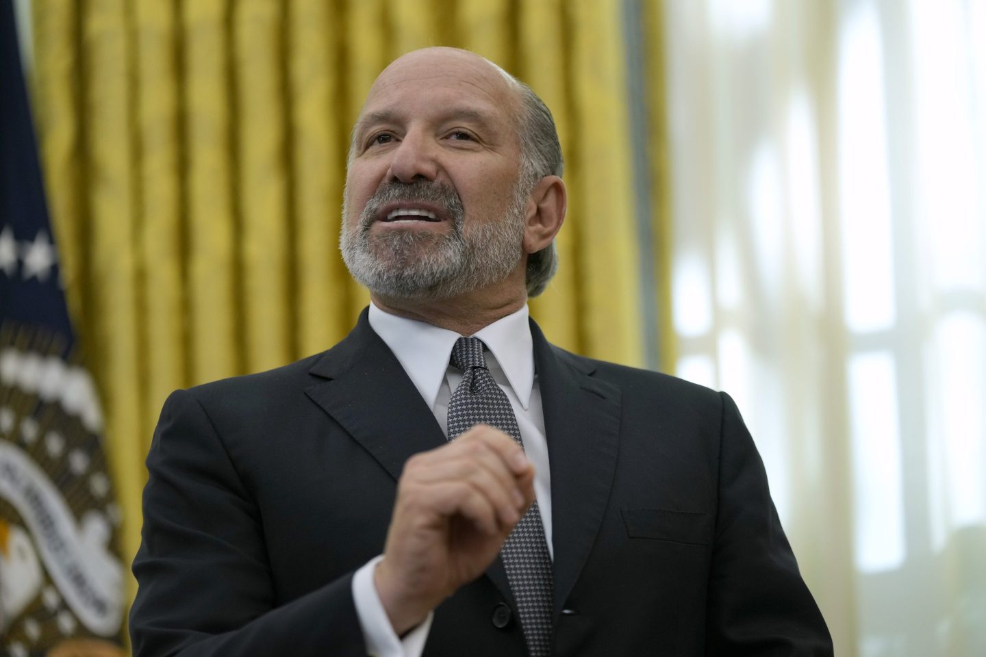 Commerce Secretary nominee Howard Lutnick speaks in the Oval Office of the White House after President Donald Trump signed an executive order, on Feb. 13, 2025, in Washington.