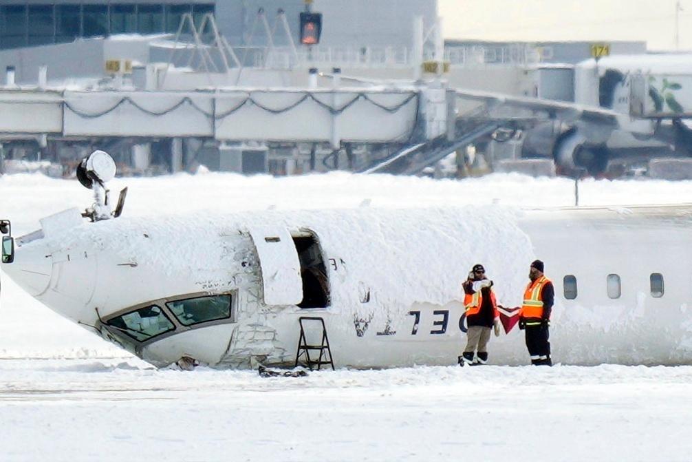 Investigators to probe why Delta jet burst into flames and flipped after landing ‘so hard that the right main [landing] gear collapsed’