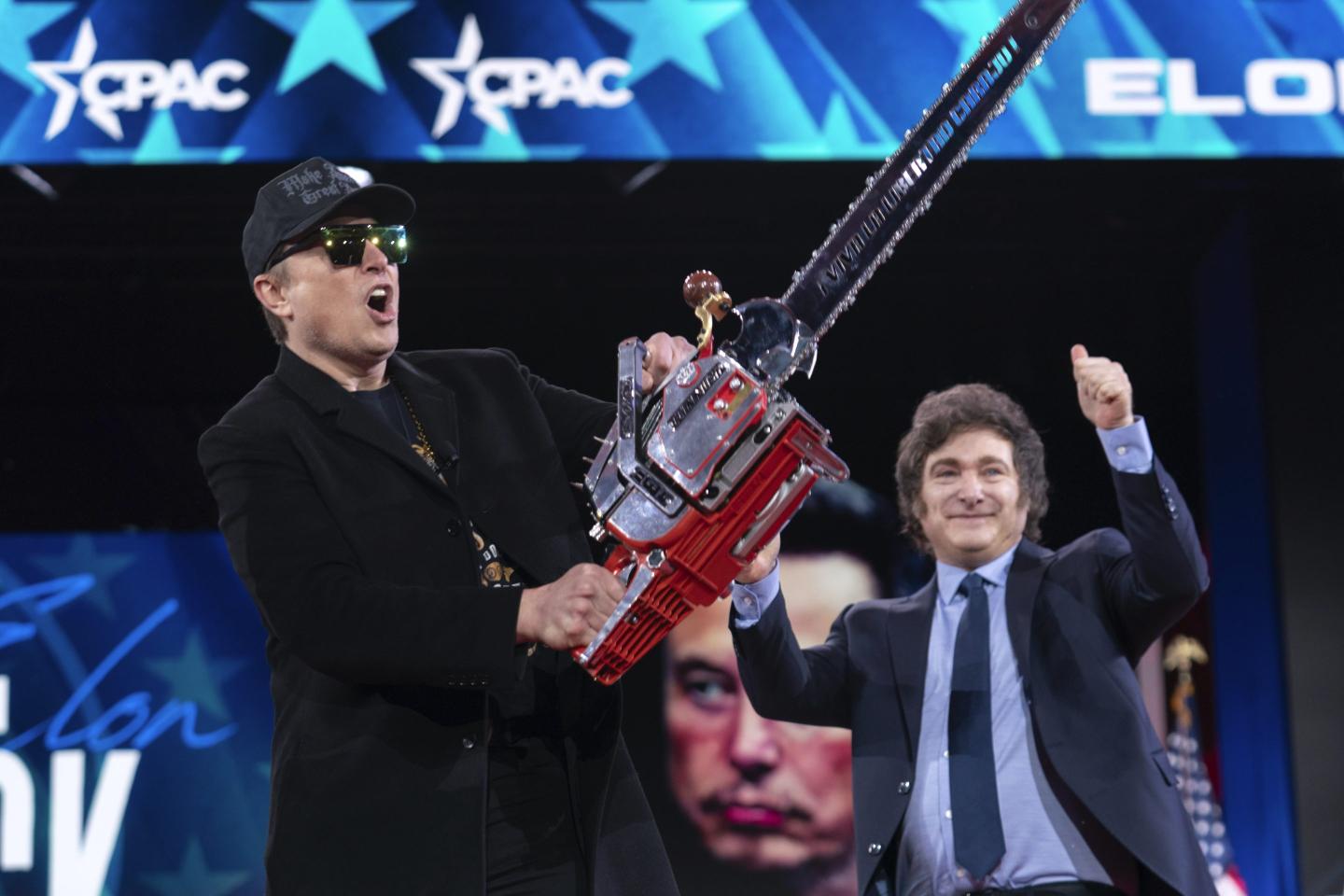 Elon Musk wields a chainsaw