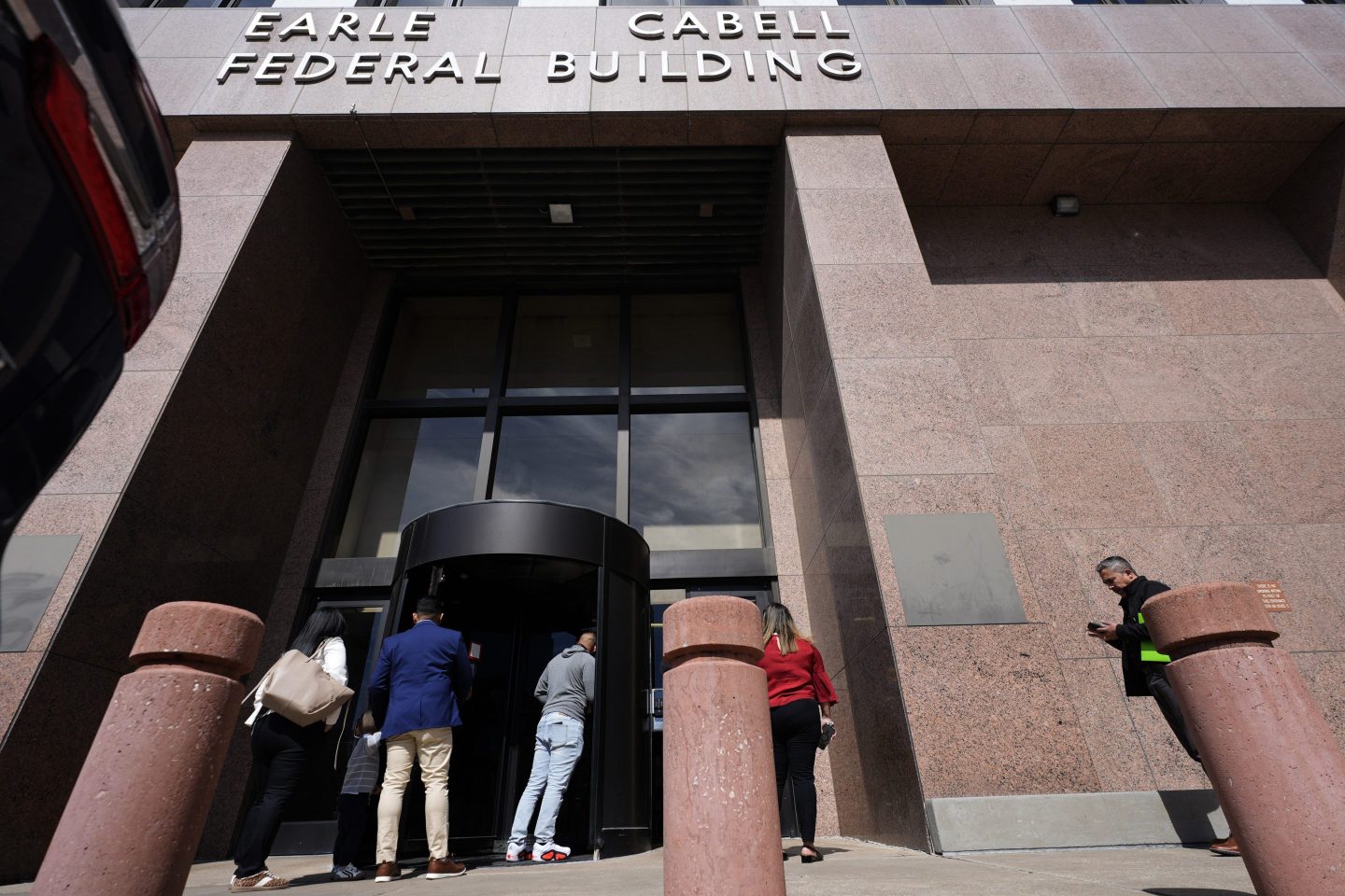 People enter the Earle Cabell Federal Building in downtown Dallas, on Feb. 24, 2025.