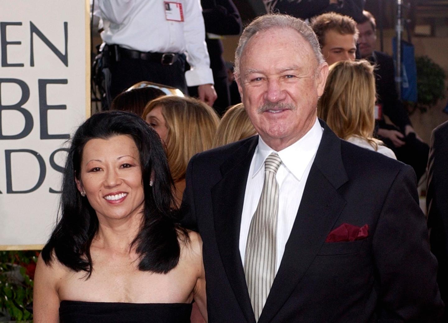 Gene Hackman smiles with his wife Betsy Arakawa