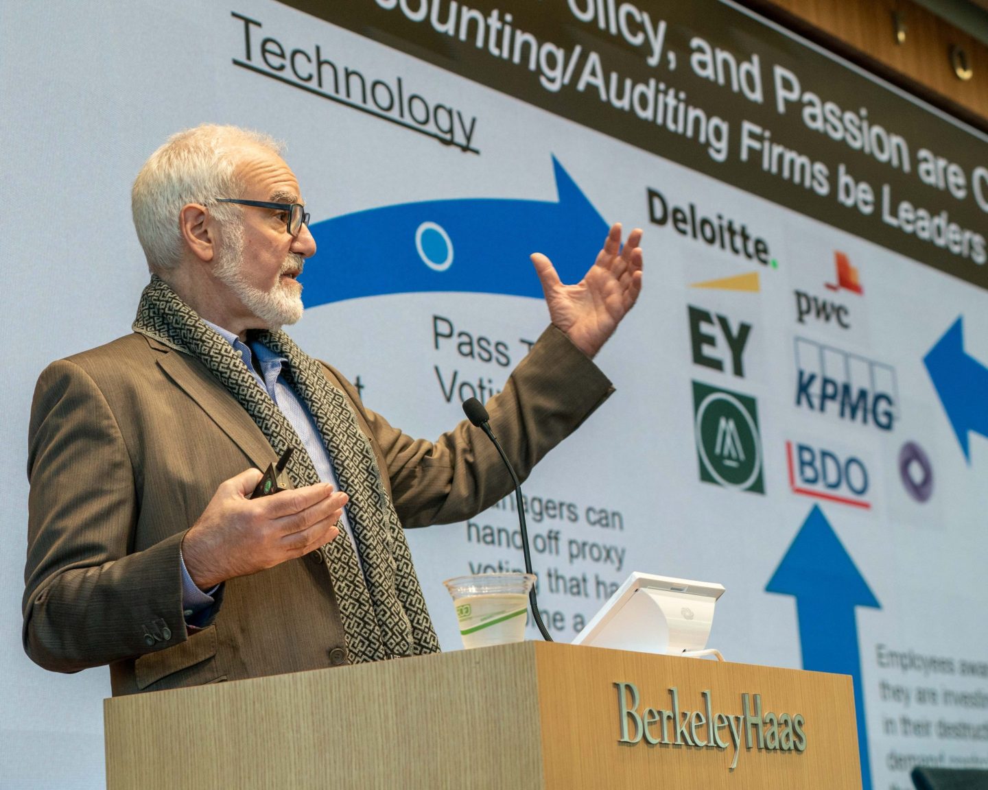 Andy Behar, CEO of As You Sow, stands at a podium speaking