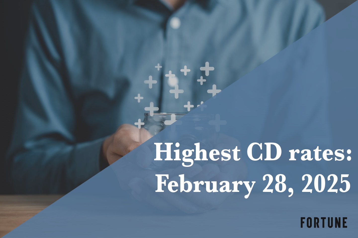 A person holding a jar full of coins.