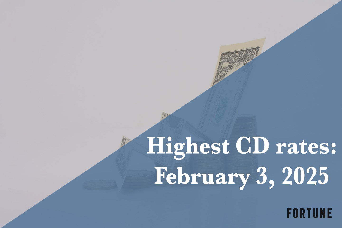 A folded dollar bill on stacks of coins.