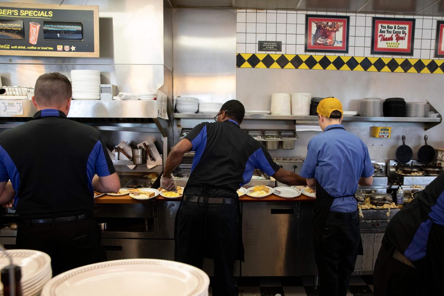Waffle House workers cooking on the line