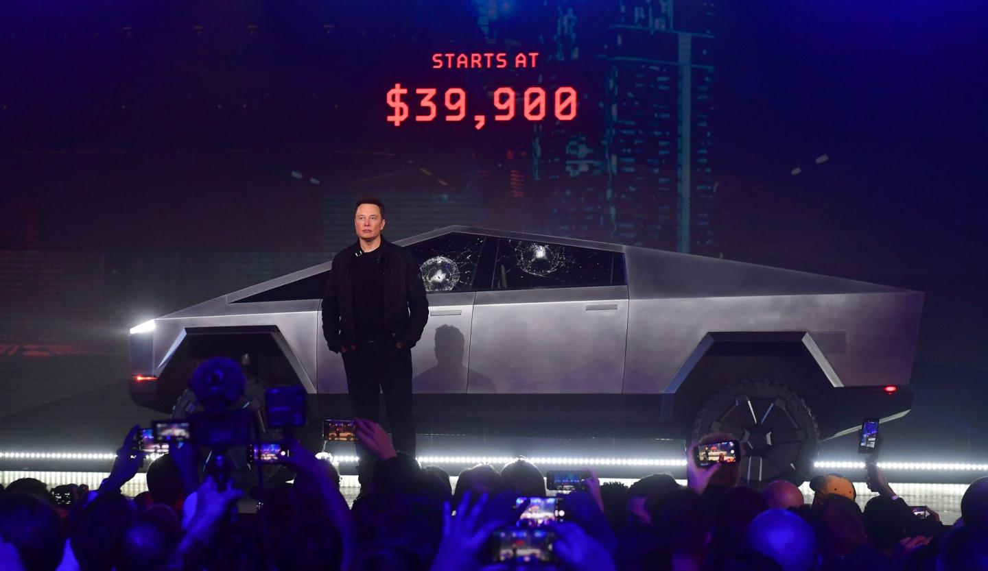 Tesla co-founder and CEO Elon Musk stands in front of the newly unveiled all-electric battery-powered Tesla's Cybertruck at Tesla Design Center in Hawthorne, California on November 21, 2019.