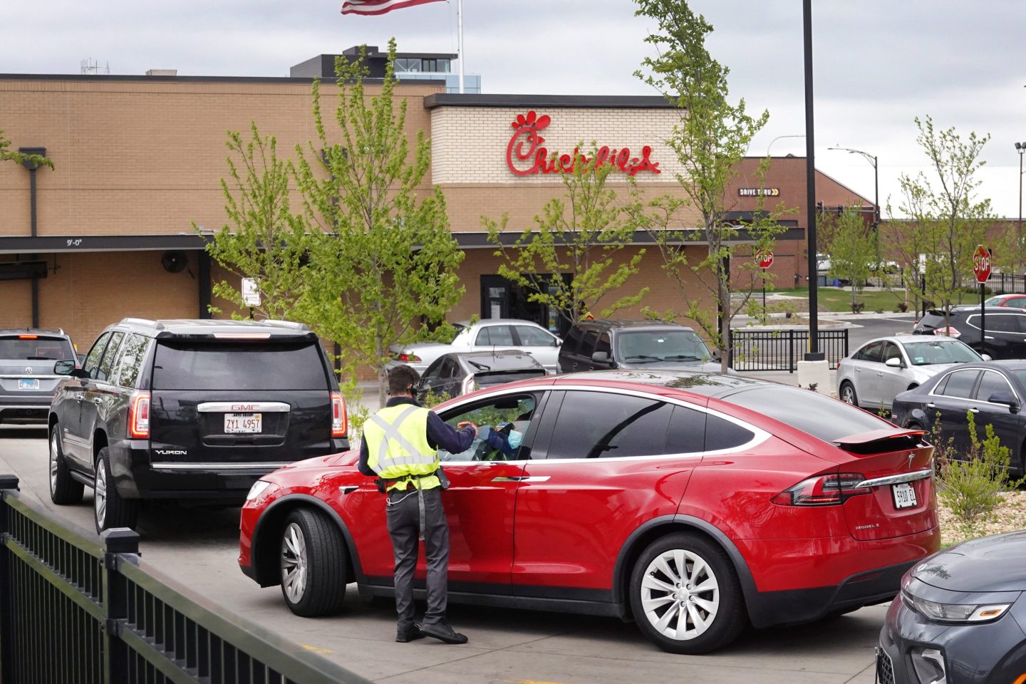 Chick-fil-A worker taking a drive-thru order