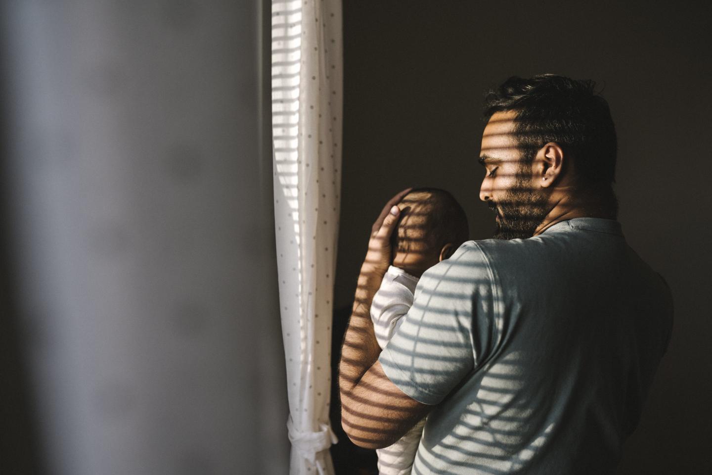 A man holding a baby