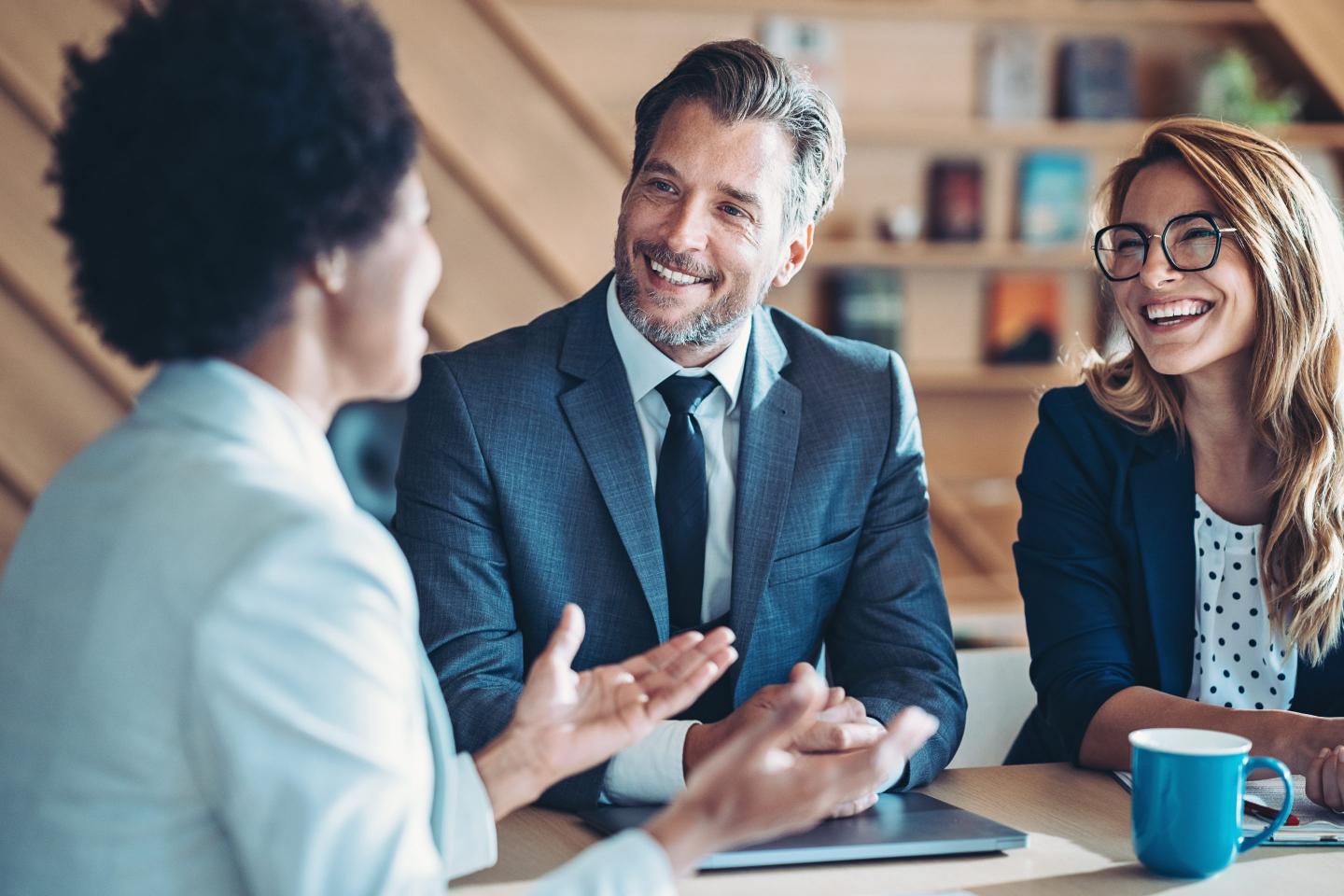 Photo of business persons talking in an office