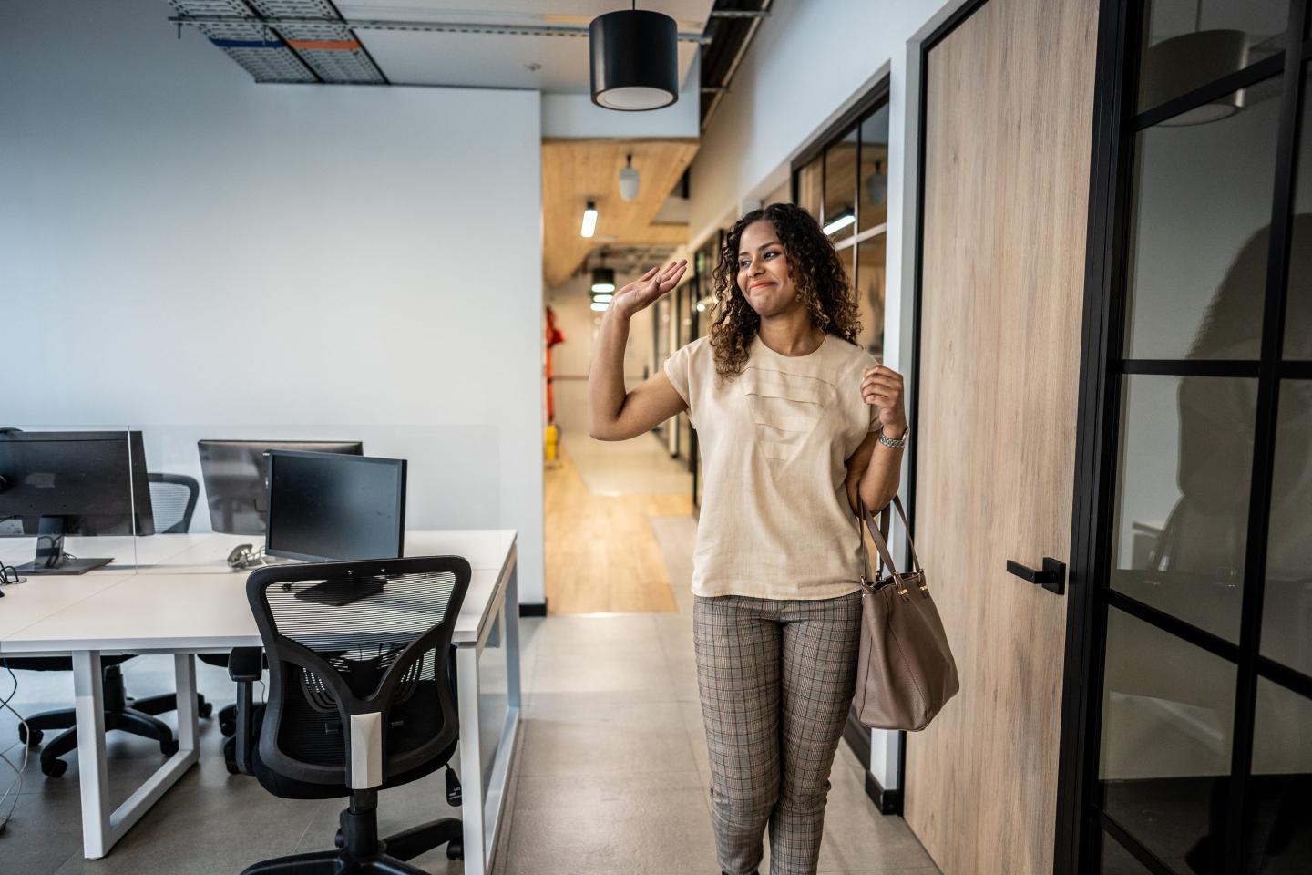 Worker comes into office late and happy