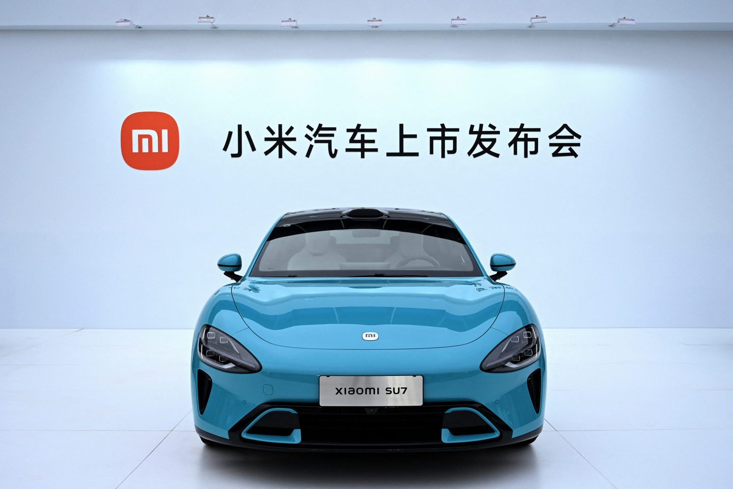 Chinese electronics company Xiaomi's first electric vehicle 'Xiaomi SU7 model' is seen on display at a launch event in Beijing on March 28, 2024.