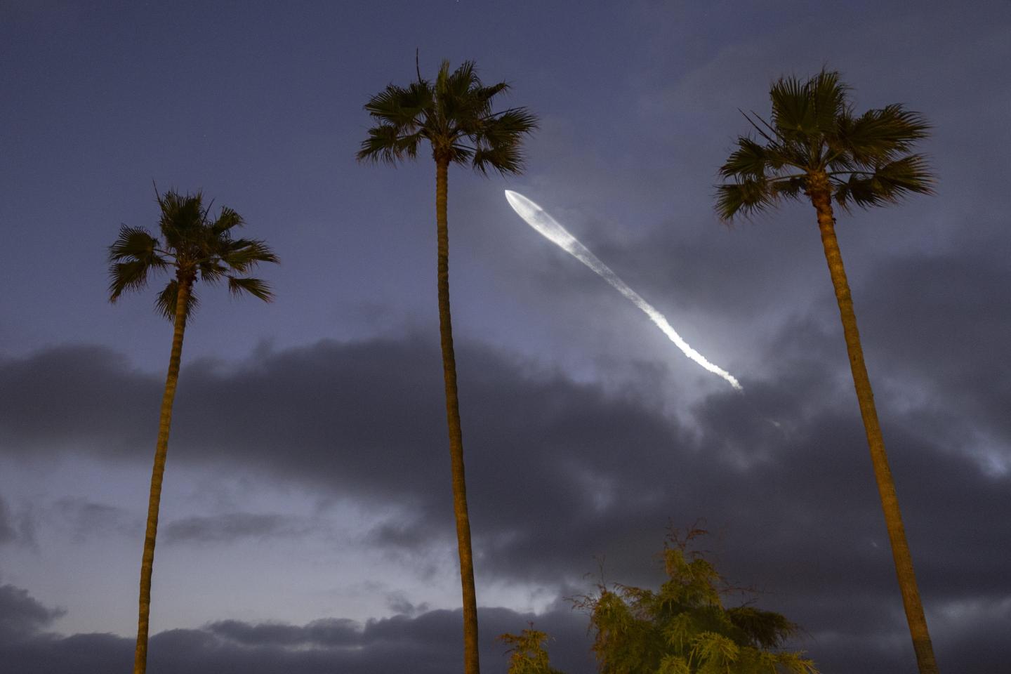 A Falcon 9 rocket with Starlink satellites on board takes off