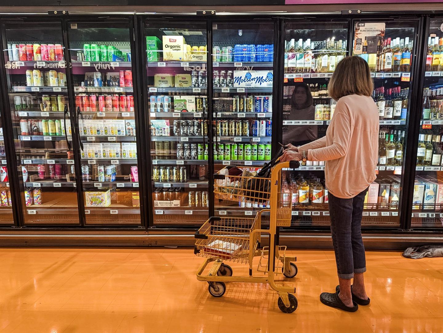 Canadian authorities are removing American liquor brands from government stores as Canada prepares retaliation