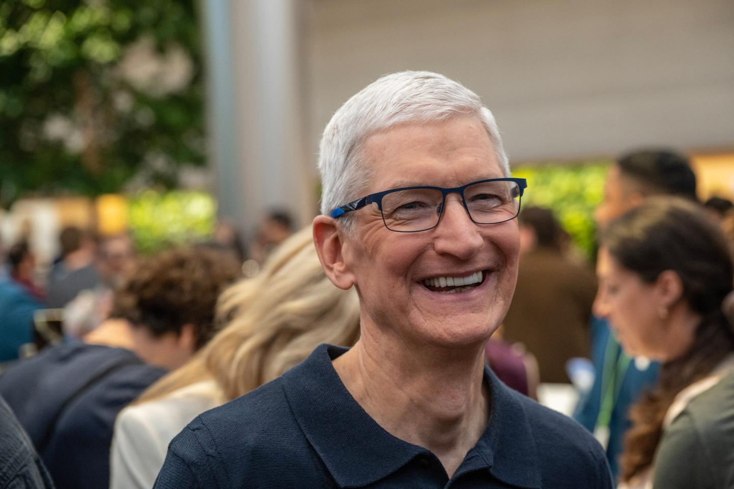 Close up of Tim Cook smiling outside.