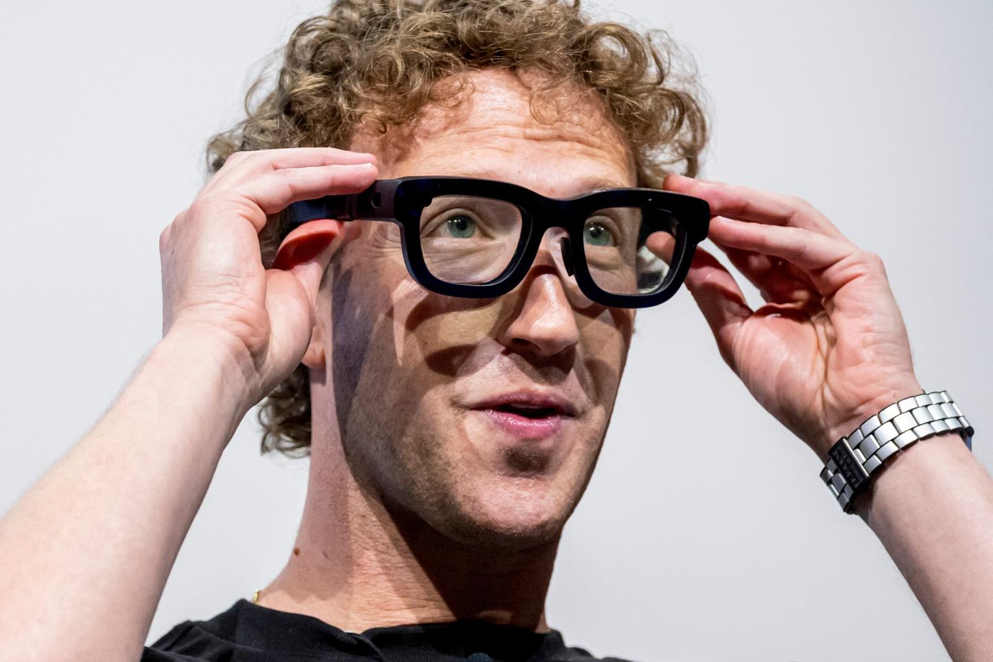 Mark Zuckerberg adjusts his bulky AR glasses