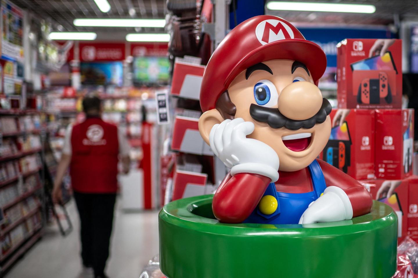 Nintendo cuts profit forecast after weak Switch sales as the video game company teases its next device