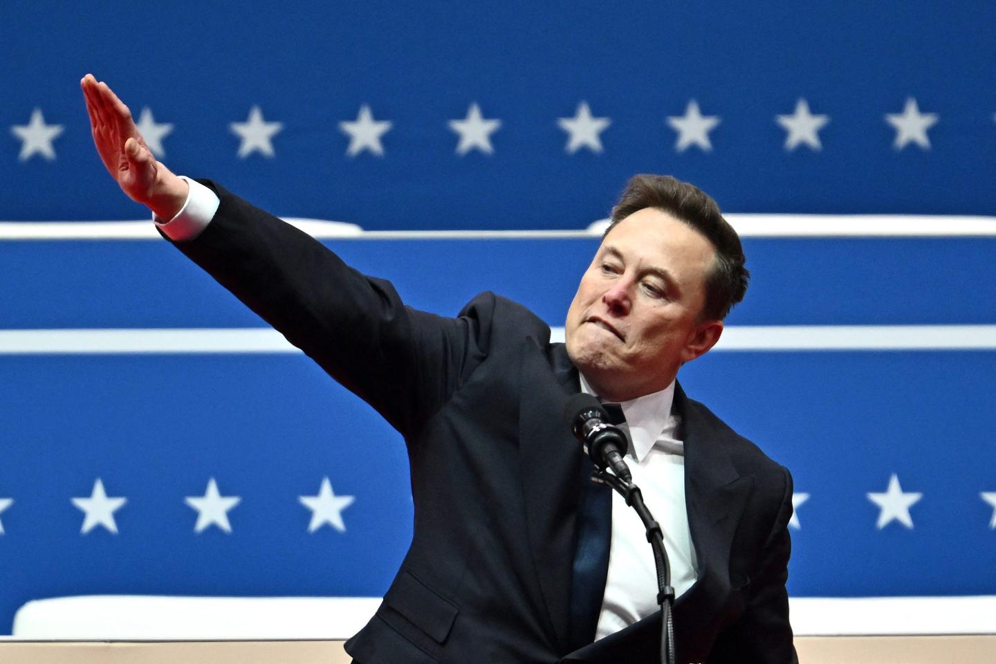 Tesla and SpaceX CEO Elon Musk gestures as he speaks during Donald Trump's inauguration.