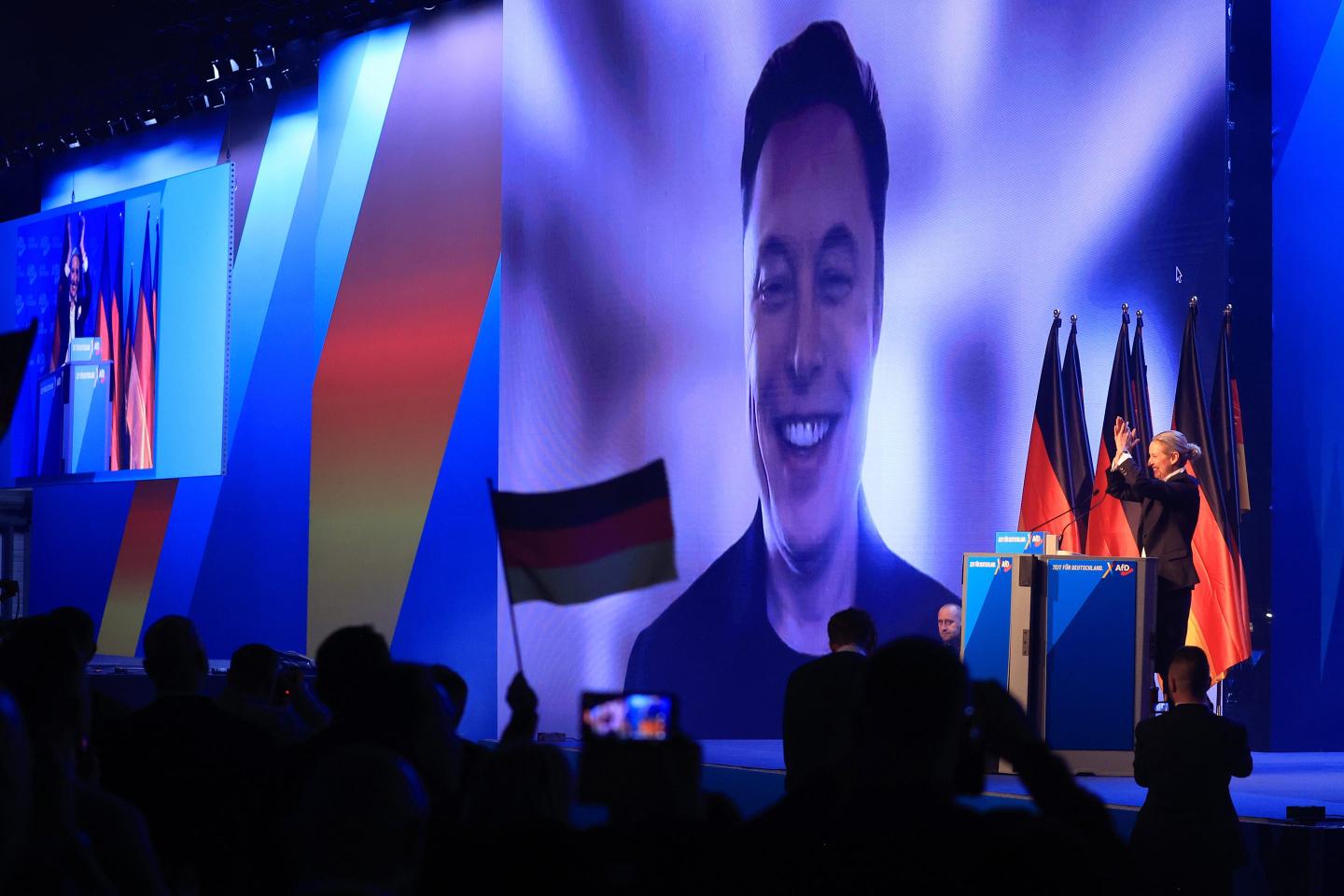 Elon Musk, chief executive officer of Tesla Inc., speaks virtually alongside Alice Weidel, co-leader of Alternative for Germany (AfD), during a the party's general election campaign launch in Halle, Germany, on Saturday, Jan. 25, 2025.