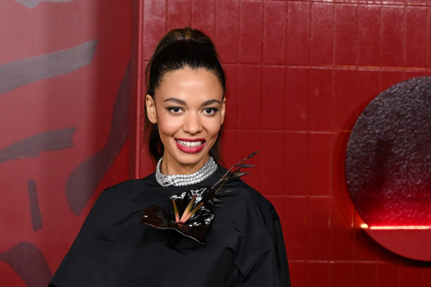 black woman in formal dress smiling for a photo portrait