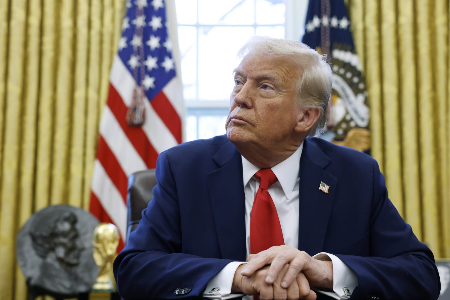President Donald Trump speaks to reporters in the Oval Office on Monday.