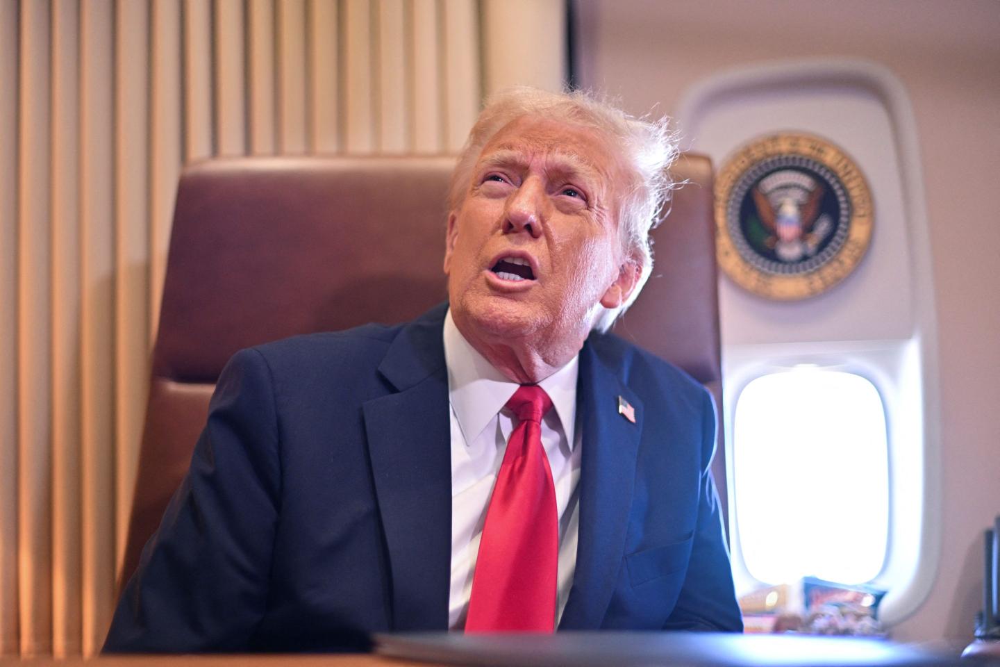 US President Donald Trump speaks to the press after signing a proclamation renaming the Gulf of Mexico as the Gulf of America aboard Air Force One