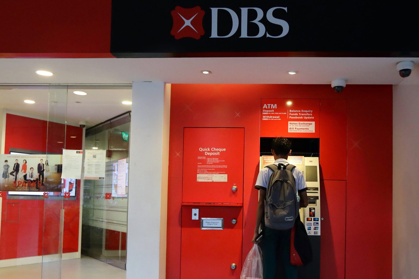 A customer uses an ATM at a DBS bank branch in Singapore on Feb. 10, 2025.