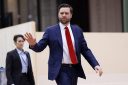 JD Vance waves as he arrives at the global AI Summit in Paris