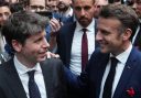 French President Emmanuel Macron speaks with Sam Altman, CEO of OpenAI.