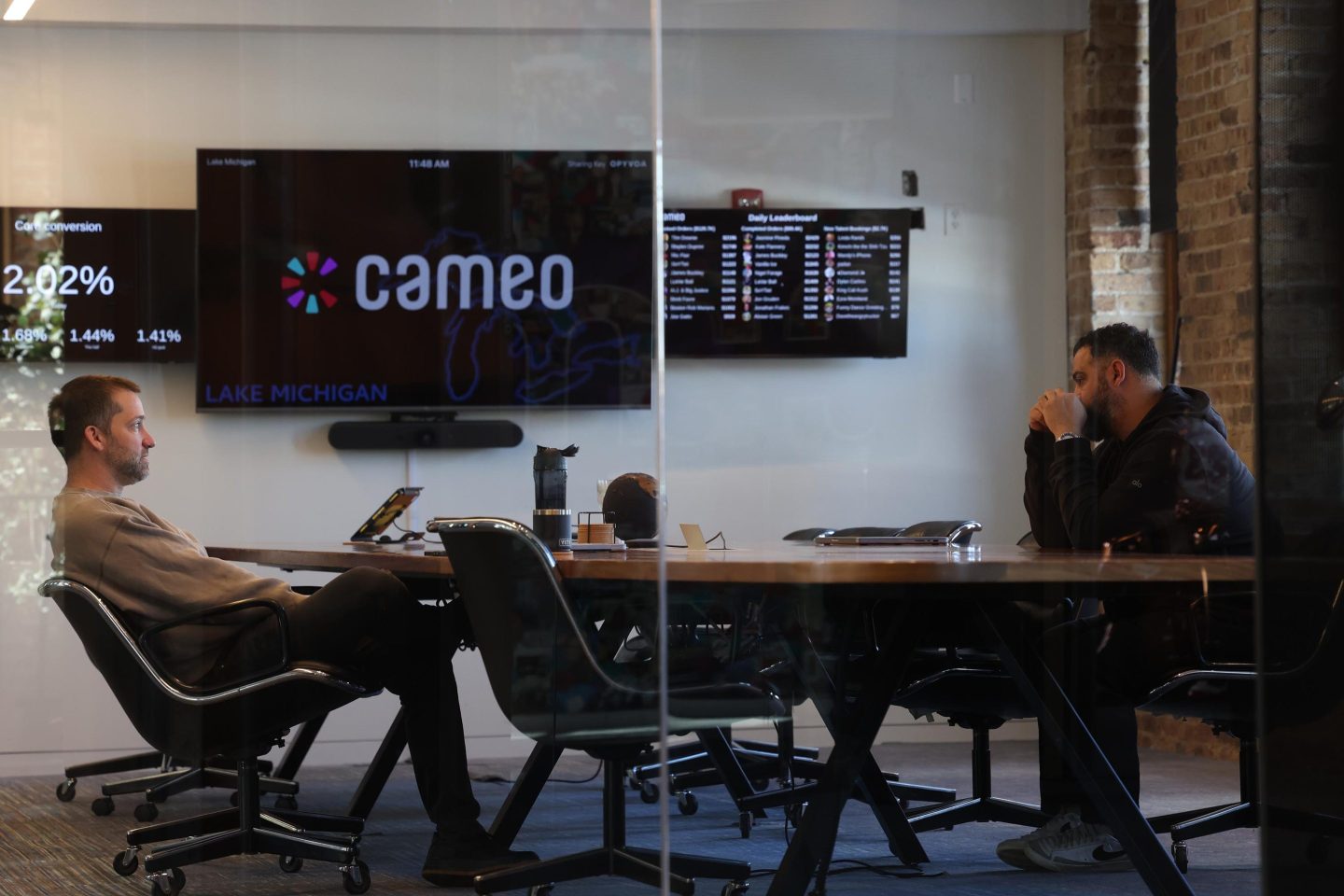 Chief Technology Officer Dom Scandinaro, left, and Steven Galanis, CEO, meet in a boardroom at Cameo, the Chicago-based celebrity video messaging company, on Feb. 13, 2025.
