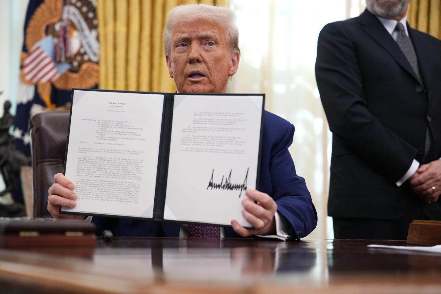 U.S. President Donald Trump delivers remarks after signing an executive order on reciprocal tariffs in the Oval Office at the White House.