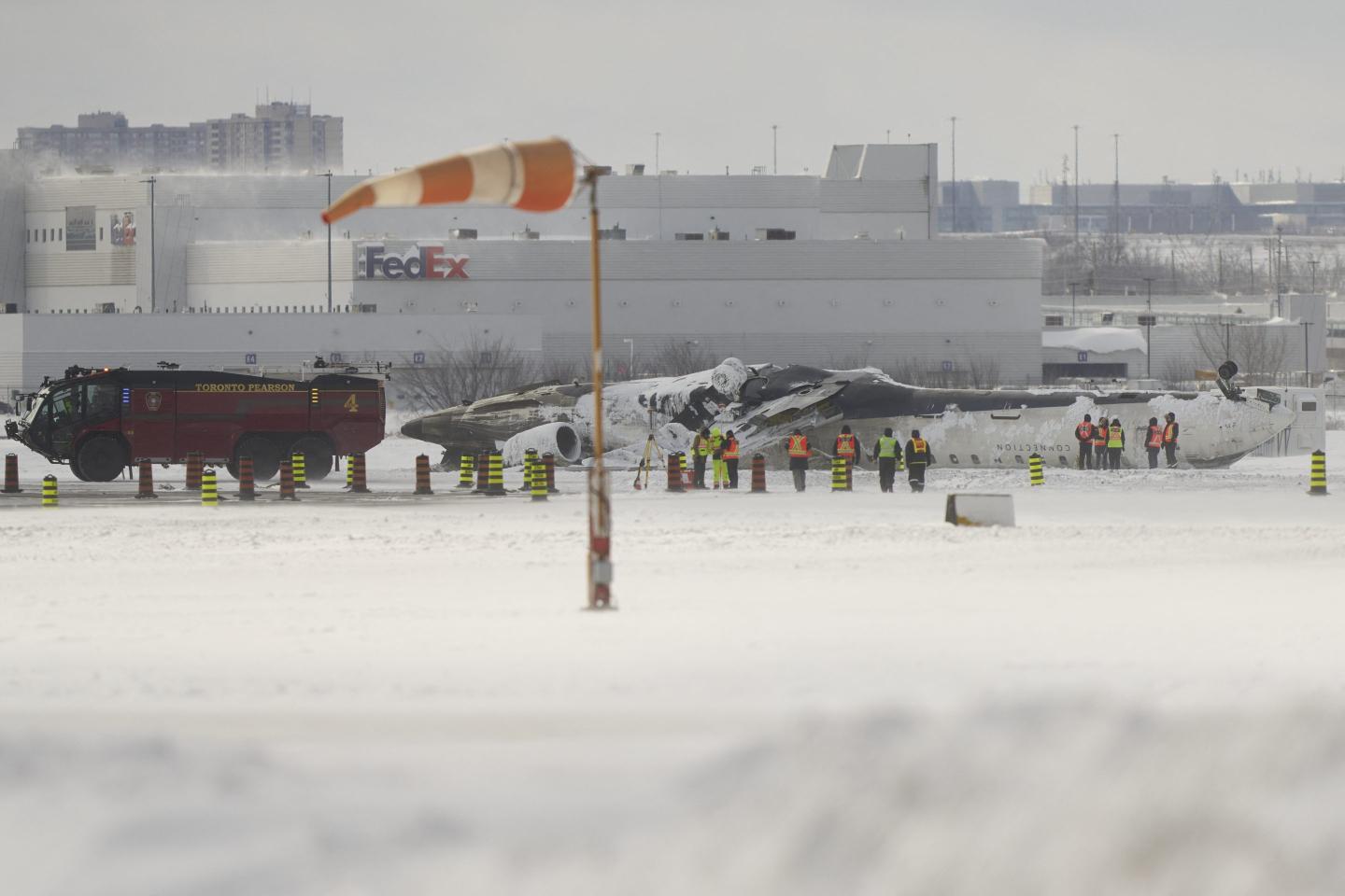 Delta is offering $30,000 with ‘no strings attached’ to passengers on the Toronto flight that crash-landed. Legal experts say they should read the fine print