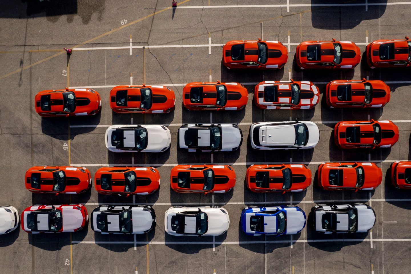 Overhead view of Nissan vehicles at an automotive processing terminal