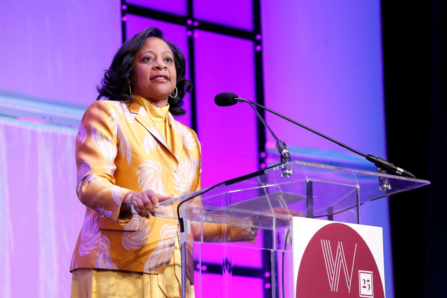 businesswoman speaking onstage