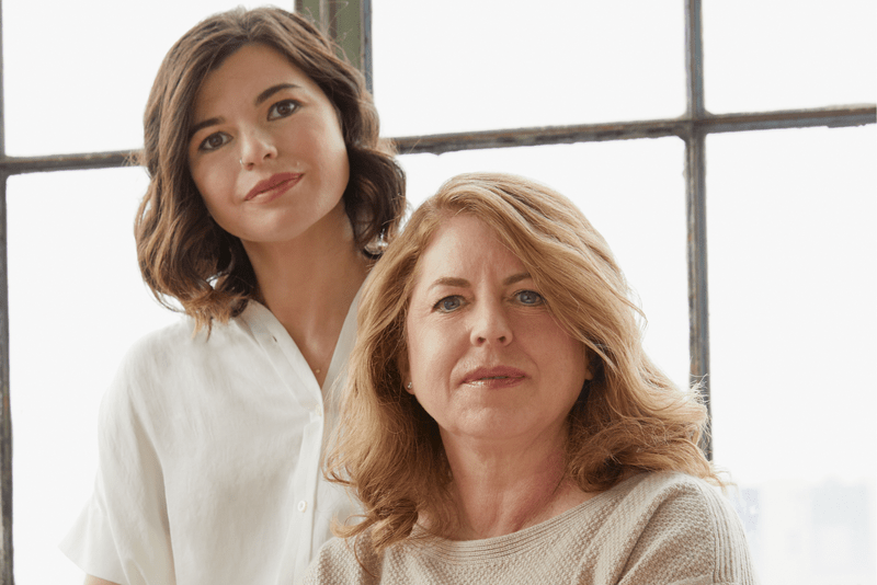 Two women pose for a photo
