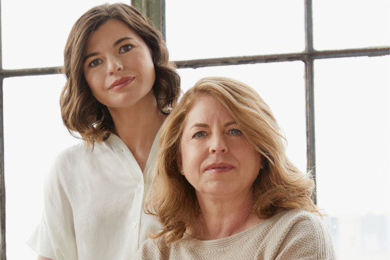 Two women pose for a photo