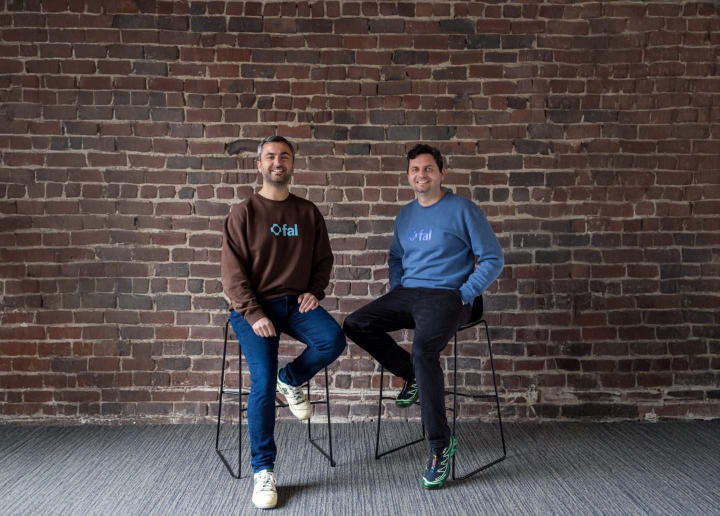 Burkay Gur and Gorkem Yurtseven in casual clothing pose for a photo portrait