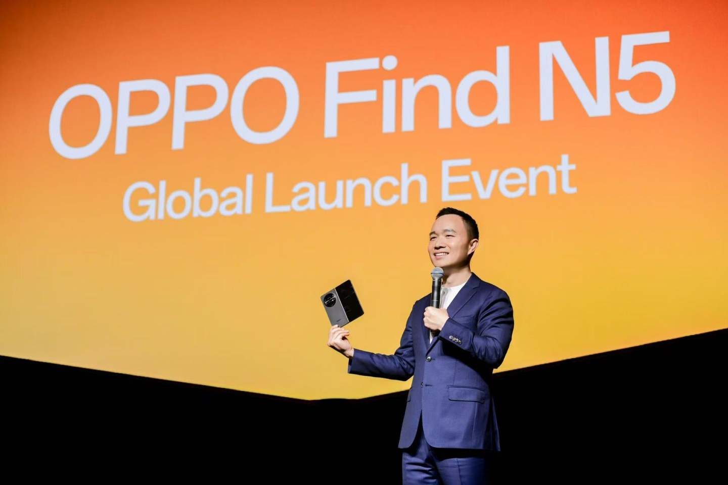 Billy Zhang, Oppo's president of overseas marketing, sales and services speaking at the Find N5 global launch event at the Marina Bay Sands in Singapore on Feb. 20, 2024.