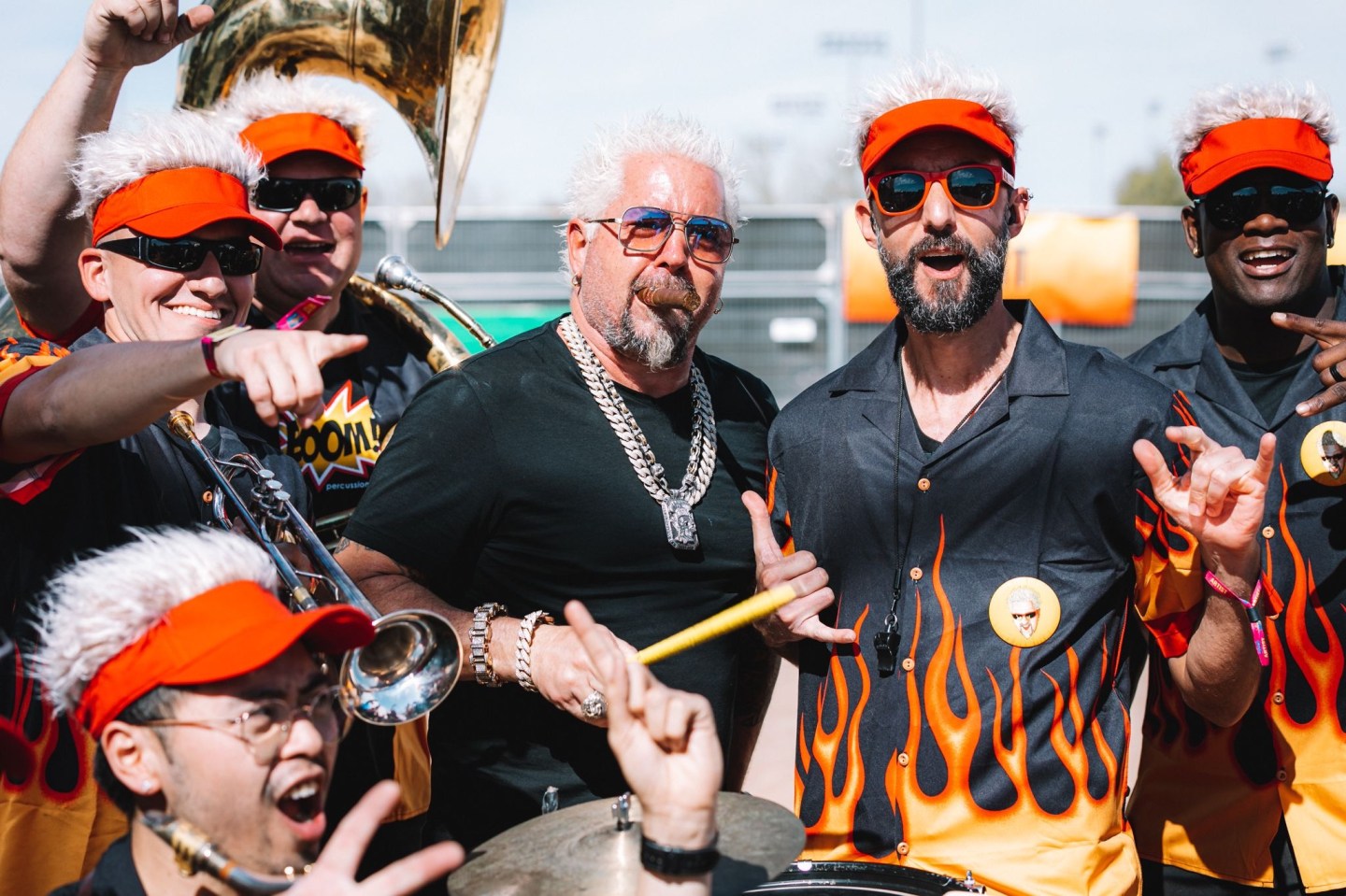 Guy Fieri posing with lookalikes