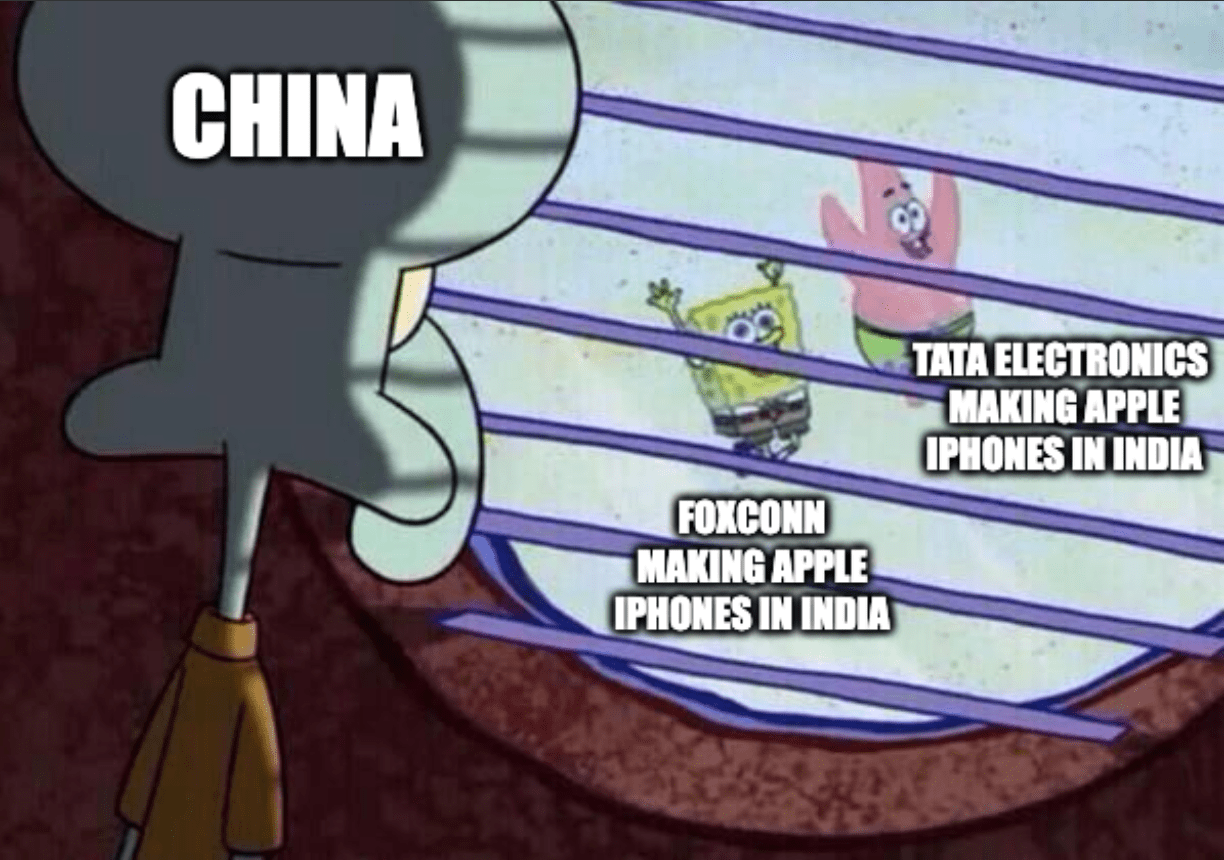 A meme of Squidward from SpongeBob SquarePants (captioned "China") looking through a window at friends playing outside (captioned "Foxconn making Apple iPhones in India" and "Tata Electronics making Apple iPhones in India")