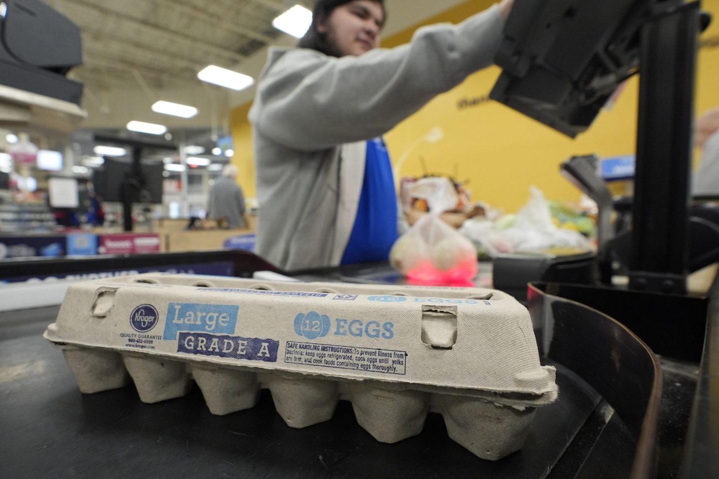 Cashier Josh Jimenez rings up egg for sale at a grocery store on Feb. 7, 2025, in Dallas.