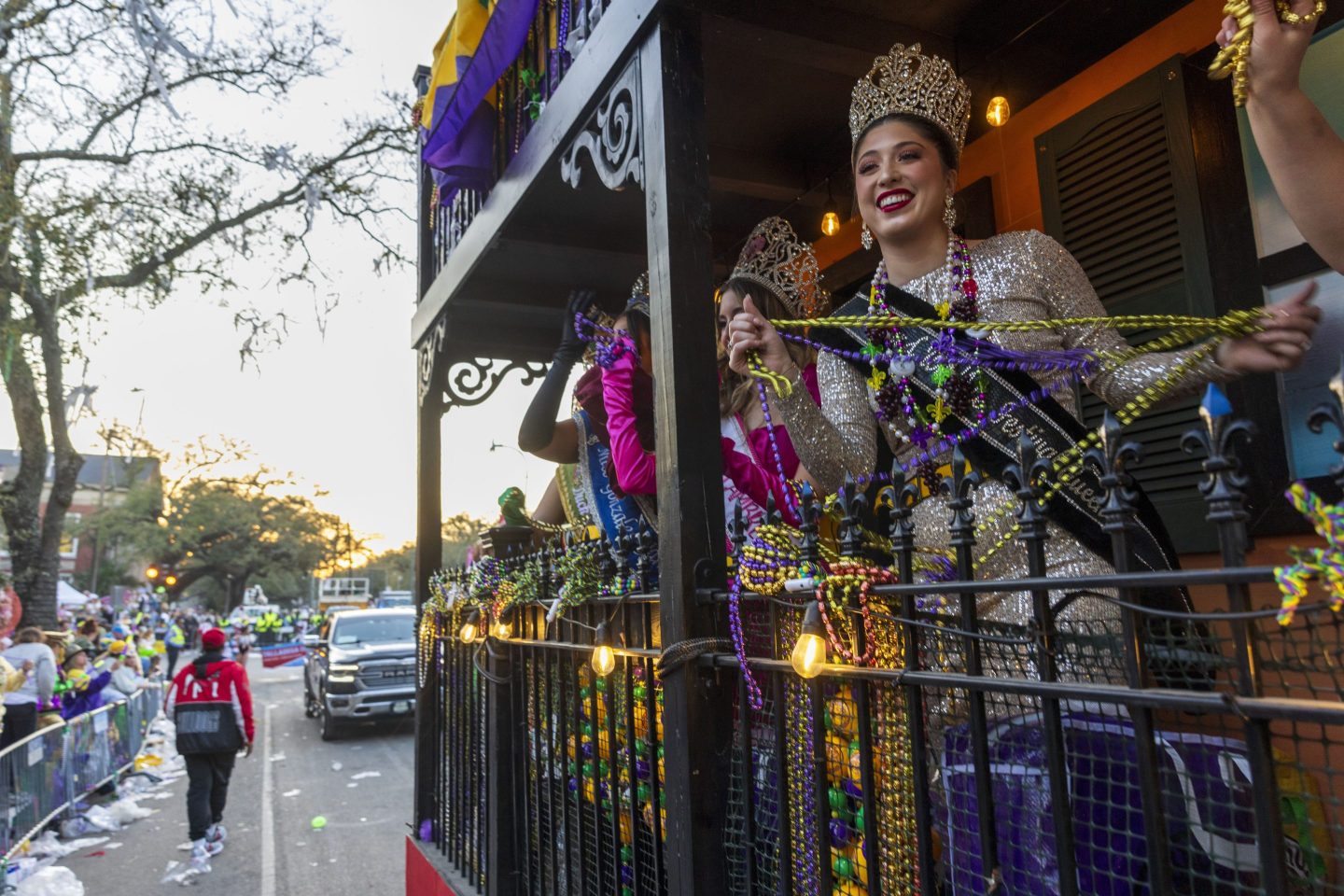 Louisiana festival queens from across the state ride in a float during the Krewe of Bacchus parade in New Orleans, on March 2, 2025.
