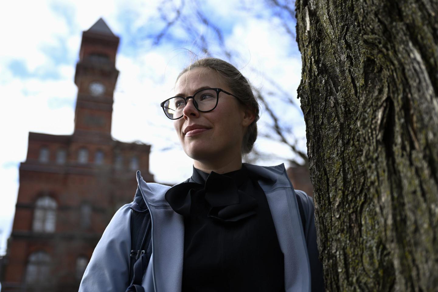A young woman outside the Sydney Yates building that houses the Forest Service