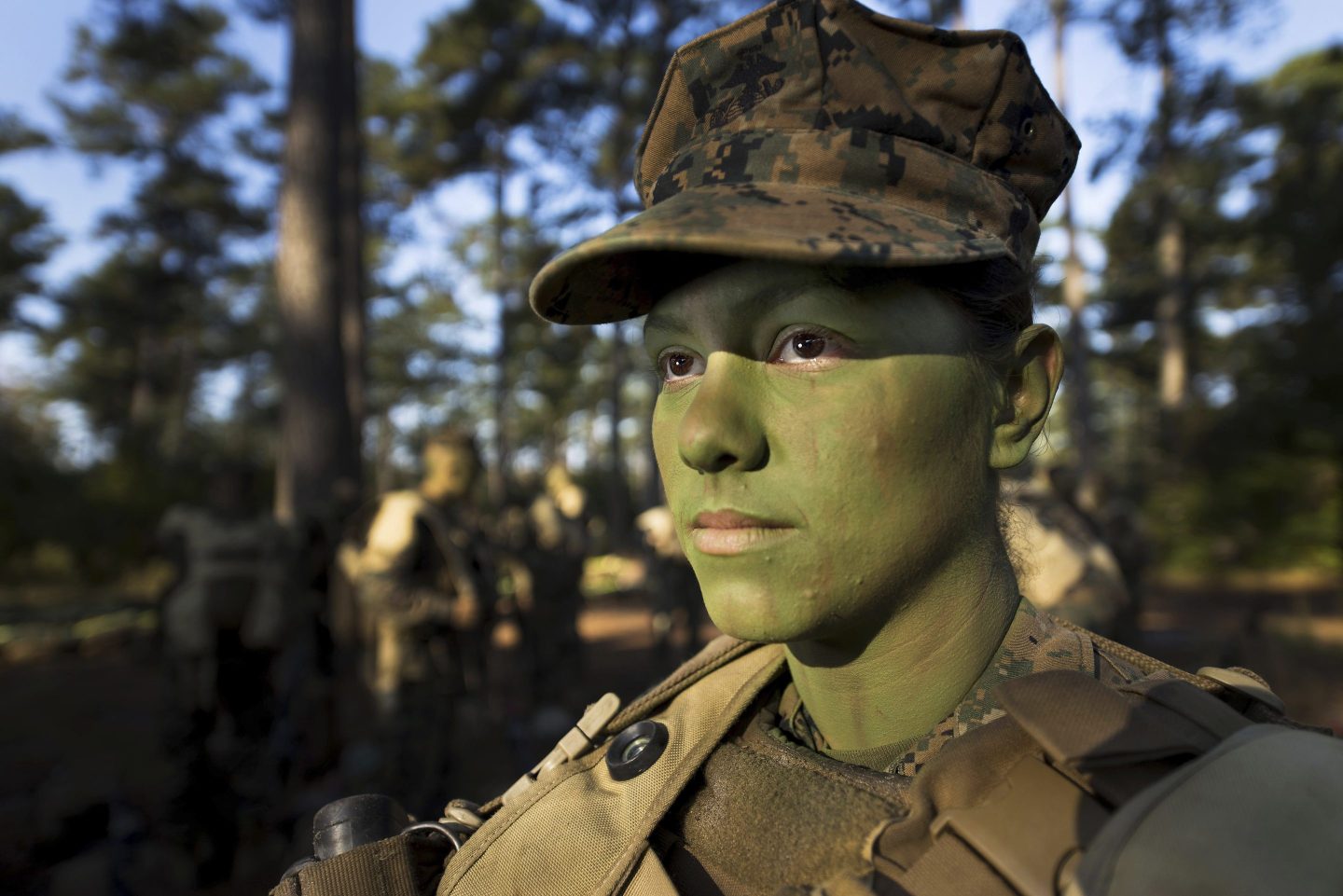 Pfc. Christina Fuentes Montenegro prepares to hike to her platoon's defensive position during patrol week of Infantry Training Battalion near Camp Geiger, N.C. Oct. 31, 2013.