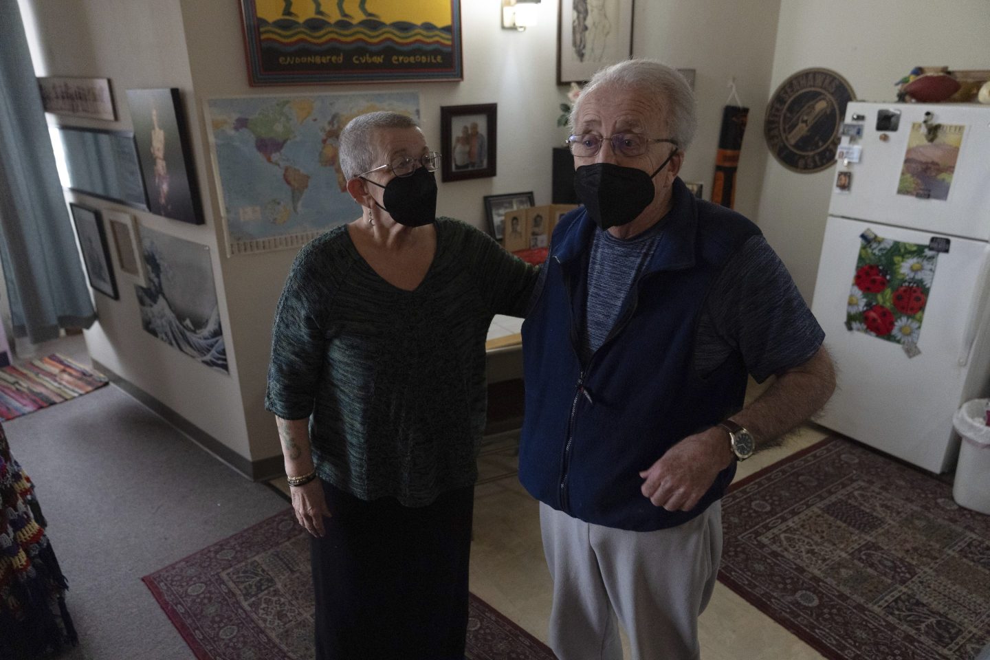 Joan Starr, left, looks at Al Hase as they stand in their apartment at Smith Tower Apartments on Monday, March 10, 2025, in Vancouver, Wash.