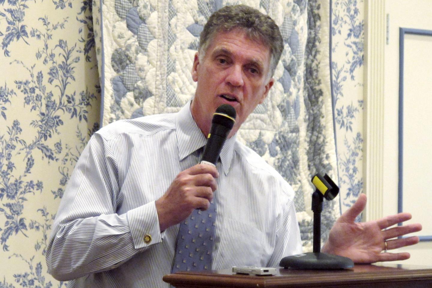 David Weldon speaks into a microphone
