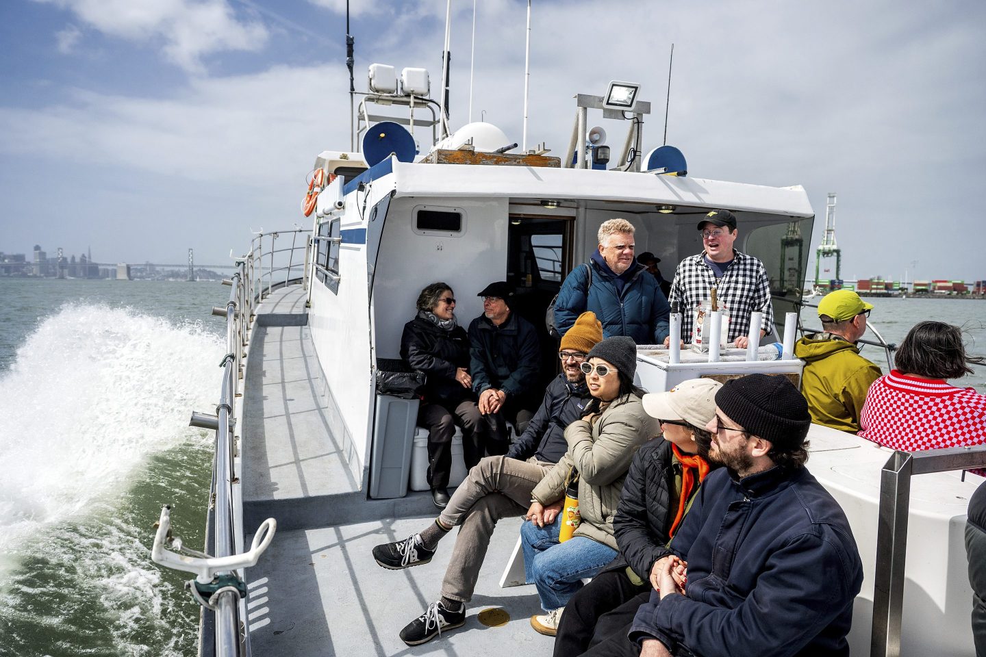 Passengers take in scenery during a history tour aboard the Pacific Pearl on March 15, 2025, in Oakland, Calif.