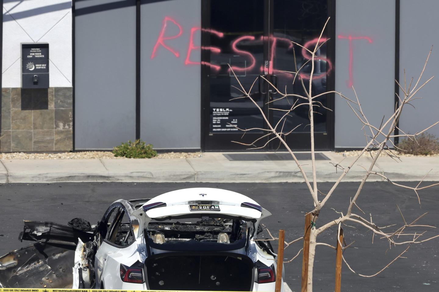 A burned Tesla vehicle is shown at a Tesla collision center Tuesday, March 18, 2025, in Las Vegas.