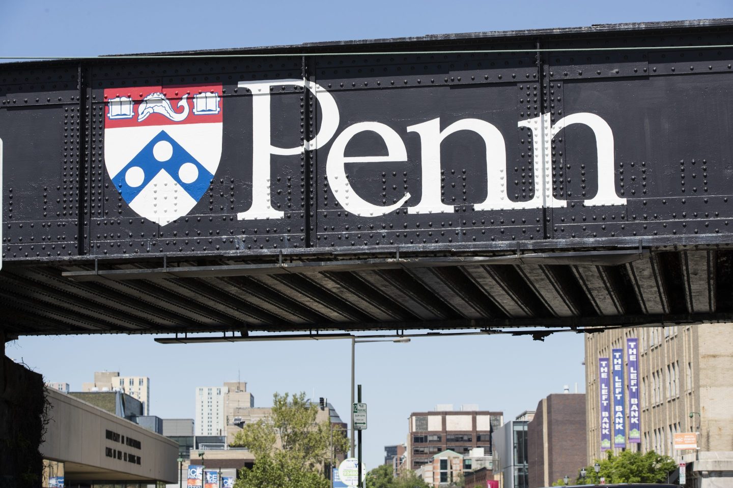 A UPenn sign on a bridge