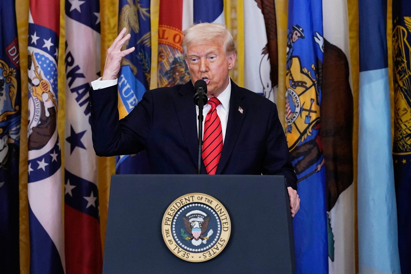 Major law firm pledges at least $100 million in free legal services in deal to avoid White House order, while two other firms sue