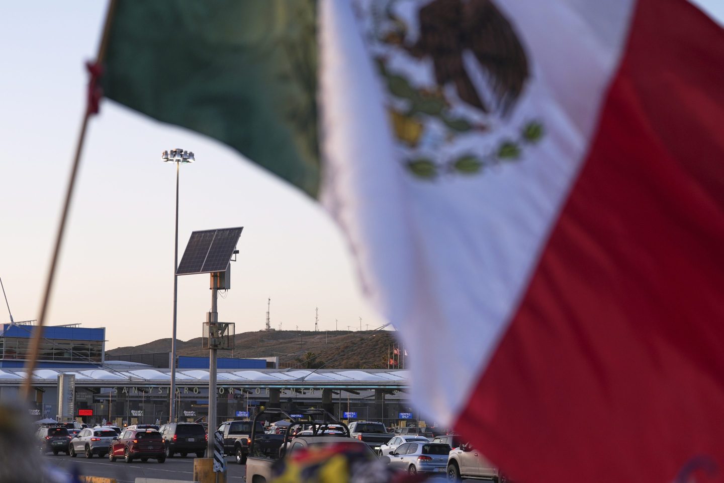 Vehicles wait in line to cross the border into the United States at the San Ysidro Port of Entry, on March 18, 2025, in Tijuana.